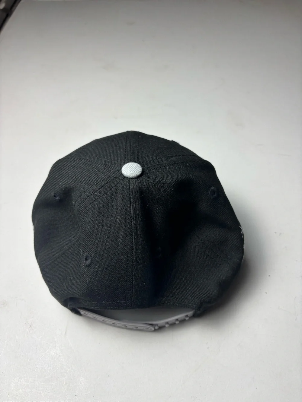 Youth New Era Las Vegas Raiders snapback cap in black & gray with white Raiders
